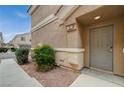 Close-up of unit #101 front door with landscaping at 1162 Red Margin Ct # 101, Las Vegas, NV 89183