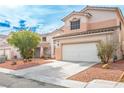 Beautiful two-story home featuring a well-kept yard and a convenient two-car garage at 1163 Regal Lily Way, Las Vegas, NV 89123