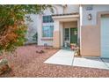 Charming home featuring a lovely front porch and a well-manicured yard at 1163 Regal Lily Way, Las Vegas, NV 89123