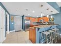 Cozy kitchen featuring a breakfast bar, stainless steel appliances, and ample counter space at 150 Las Vegas Blvd # 1004, Las Vegas, NV 89101