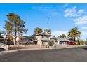 Charming two-story home with a well-manicured lawn and a spacious driveway leading to a two-car garage at 1708 Crest Ave, Las Vegas, NV 89119