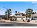 Charming two-story home featuring a well-maintained front yard and a two-car garage at 1708 Crest Ave, Las Vegas, NV 89119