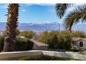 Mountain view image featuring blue skies, trees and professional landscaping at 1908 Oliver Springs St, Henderson, NV 89052