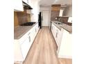 Galley-style kitchen featuring stainless appliances and updated cabinetry at 2200 S Fort Apache Rd # 2123, Las Vegas, NV 89117