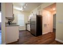 Modern kitchen with stainless steel appliances, granite countertops, and wood flooring at 231 W Horizon Ridge Pkwy # 314, Henderson, NV 89012