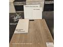 Selections for the bathroom including chrome faucet, light quartz countertop, and luxury vinyl plank flooring at 4145 Texas Lilac Ave, Las Vegas, NV 89139