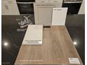 Bathroom design elements featuring a white quartz countertop, vinyl plank flooring, and chrome faucet at 4153 Texas Lilac Ave, Las Vegas, NV 89139