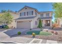 Well-maintained two-story home featuring a manicured front yard and a two-car garage at 4211 Saxton Green Ave, Las Vegas, NV 89141