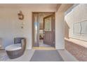 Inviting front entrance featuring a decorative door with glass panels and a cozy seating area at 4211 Saxton Green Ave, Las Vegas, NV 89141
