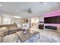Open living room with recessed lighting, wood floors, and a stylish modern design at 4211 Saxton Green Ave, Las Vegas, NV 89141