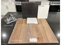 Showcasing the kitchen design, luxury vinyl plank flooring, dark cabinets, light countertop, and fixtures are displayed at 4282 Yucca Brevi Ave, Las Vegas, NV 89139