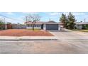 Charming single-story home featuring gray paint, desert landscaping, and a two-car garage at 4857 Fairfax Ave, Las Vegas, NV 89120