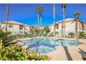 Community pool and spa with palm trees, creating a relaxing and luxurious atmosphere at 6901 Squaw Mountain Dr # 201, Las Vegas, NV 89130