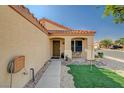 Inviting single-story home with a covered front porch and desert landscaping at 713 Salt Flats Cir, Henderson, NV 89011