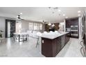 Open-concept kitchen with granite countertops, stainless steel appliances, and a spacious island at 7525 Campbell Ranch Ave, Las Vegas, NV 89179