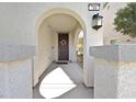 Inviting front porch entrance featuring an arched entryway and decorative wreath at 788 Grand Country Ave, North Las Vegas, NV 89086
