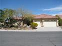 Beautiful home featuring desert landscaping, a two-car garage, and a clay tile roof in a well-kept neighborhood at 10112 Plomosa Pl, Las Vegas, NV 89134