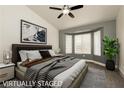 Serene main bedroom with large windows, plush bedding, and neutral tones for a relaxing retreat at 10309 Georgetown Pl, Las Vegas, NV 89134