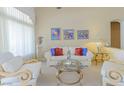 Cozy living room with comfortable seating, stylish decor, and lots of natural light at 10720 Bennington Ct, Las Vegas, NV 89134