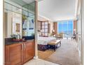 Bright bedroom suite offering city views, workspace, sitting area, and convenient wet bar at 135 E Harmon Ave # 3704, Las Vegas, NV 89109