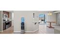 View of open concept kitchen and dining area with modern appliances and abundant natural light at 1720 S Blagg Rd, Pahrump, NV 89048