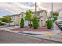 Charming two-story home with landscaped front yard in a suburban neighborhood, featuring a two-car garage at 3043 Jacaranda Dr, Las Vegas, NV 89117