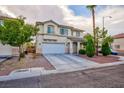 Inviting two-story home with a two-car garage, manicured landscaping, and a well-maintained front yard at 3043 Jacaranda Dr, Las Vegas, NV 89117