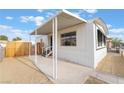 Well-kept home featuring awnings, a small porch and easy access to a fenced-in yard at 3540 Estes Park Dr, Las Vegas, NV 89122