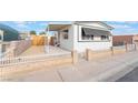 Charming single-story home featuring awnings, low fencing, and a well-maintained front yard at 3540 Estes Park Dr, Las Vegas, NV 89122