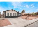 Inviting single-story house with a well-kept yard, neat design, and convenient driveway at 3915 Delling Ct, Las Vegas, NV 89104