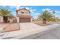 Charming home featuring a two-car garage, a long driveway, and mature palm trees at 4712 Belshire Dr, Las Vegas, NV 89147