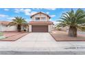 Charming two-story home featuring a two-car garage, a long driveway, and a terracotta-tiled roof at 4712 Belshire Dr, Las Vegas, NV 89147