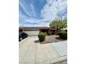 Charming single-story home features two-car garage, solar panels, and attractive landscaping at 5268 Caspian Dr, Las Vegas, NV 89118