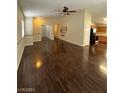 Inviting living room with hardwood floors, neutral walls, and an open layout at 5433 Bridgehampton Ave, Las Vegas, NV 89130