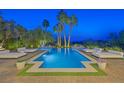 Inviting pool area with comfortable lounge chairs and serene landscaping at 6 Rue Du Ville Way, Henderson, NV 89011