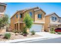 Attractive two-story home with a two-car garage, desert landscaping, and mature trees at 6476 Ness Gardens Ct, Las Vegas, NV 89122