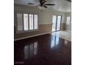 Spacious living room boasting hardwood floors, and abundant natural light at 6476 Ness Gardens Ct, Las Vegas, NV 89122