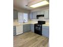 Kitchen with ample counter space and gray cabinets at 6532 Moon Roses Ct, Las Vegas, NV 89108
