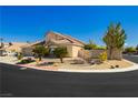 Well-maintained home featuring desert landscaping, a three-car garage, and charming curb appeal on a sunny day at 6617 Golden Bit Ave, Las Vegas, NV 89131