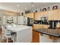 Bright kitchen with stainless steel appliances, a large island, and light wood cabinetry, great for entertaining at 6617 Golden Bit Ave, Las Vegas, NV 89131