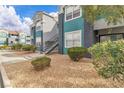 Multi-level condo with exterior stairs and xeriscaping at 6955 N Durango Dr # 1074, Las Vegas, NV 89149