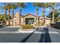 Beautiful clubhouse entrance with palm trees, parking, and well-maintained landscaping at 8000 Badura Ave # 2063, Las Vegas, NV 89113