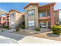 Well-maintained apartment building with stairs and manicured landscaping at 8000 Badura Ave # 2063, Las Vegas, NV 89113