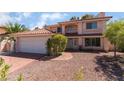 Inviting exterior of a two-story house with lush landscaping at 9005 Feather River Ct, Las Vegas, NV 89117