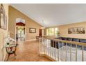 Bright living space with high ceilings and tiled floors; view into the dining room at 950 Eagle Mountain Dr, Las Vegas, NV 89123