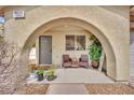 Inviting covered front porch featuring a seating area with attractive decor at , Las Vegas, NV 89139