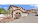 Attractive home featuring a red tile roof, an arched front entrance and two car garage at , Las Vegas, NV 89139