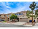 Charming two-story home features a two-car garage, desert landscaping, and a tile roof at 10657 Medicine Bow St, Las Vegas, NV 89183