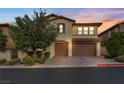 Charming two-story home featuring a three-car garage and well-manicured landscaping at 12283 Lost Treasure Ave, Las Vegas, NV 89138