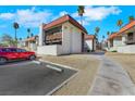Apartment building shows off a red car parked alongside a two story complex in a desert setting at 1405 Vegas Valley Dr # 312, Las Vegas, NV 89169